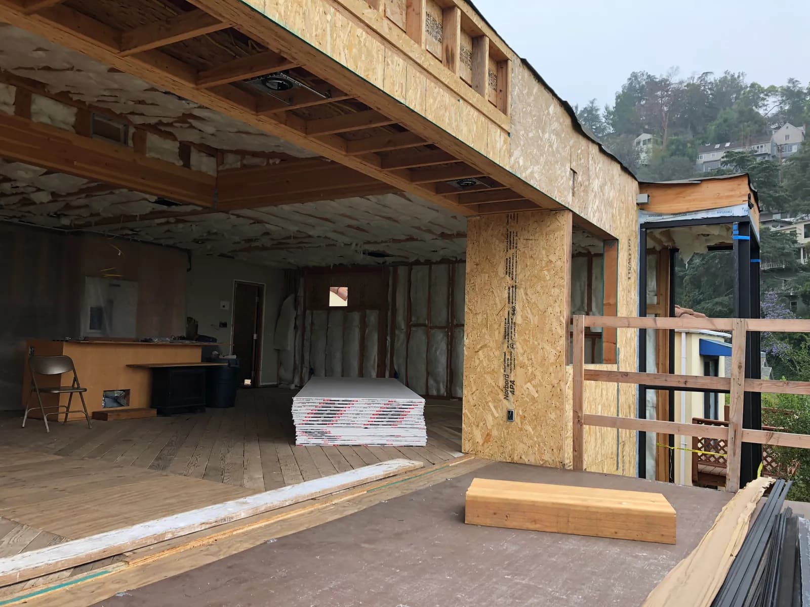 Framing at the deck opening of the hillside house.