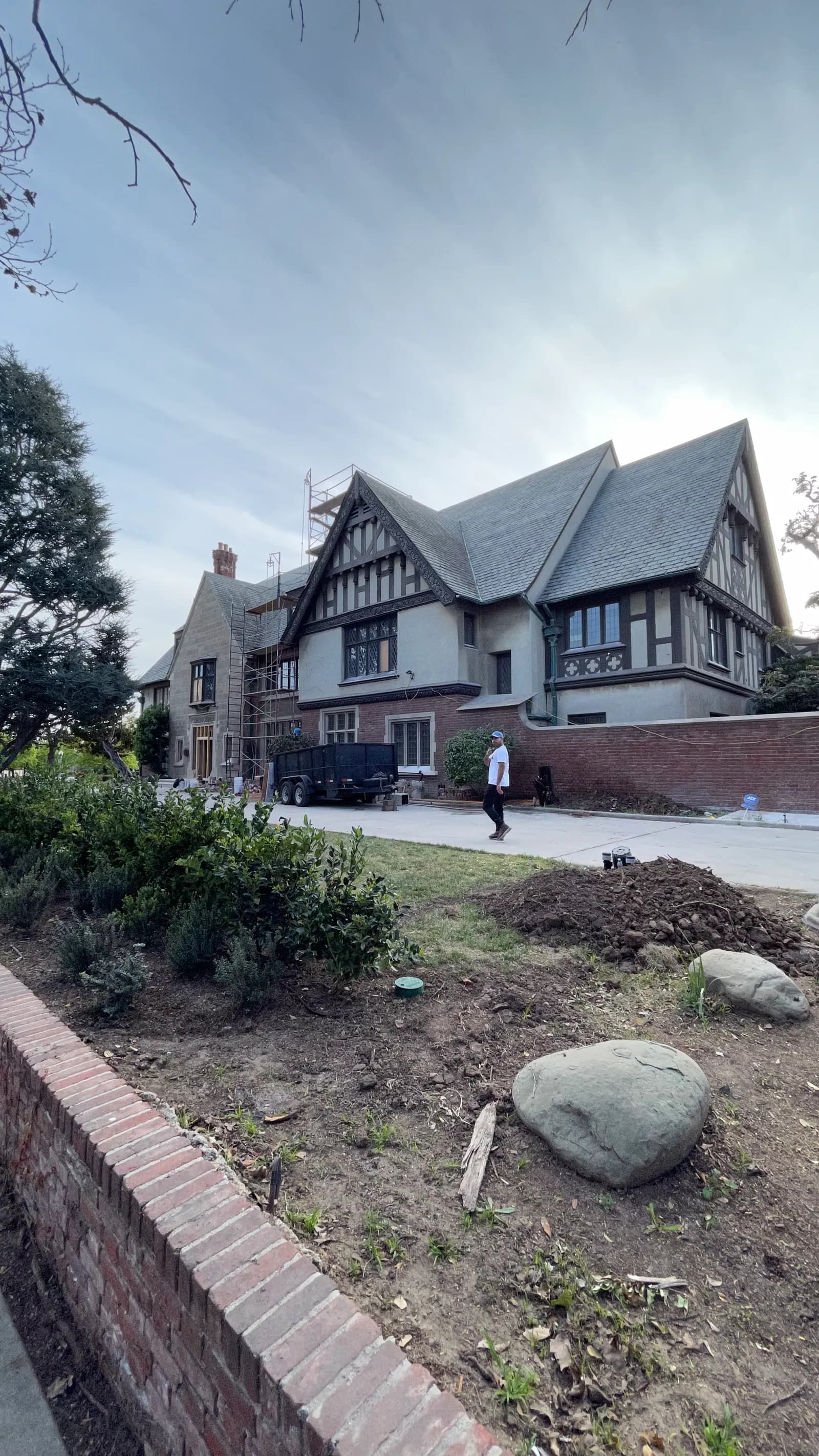 The front elevation of the Tudor house in Hancock Park, mid-renovation.