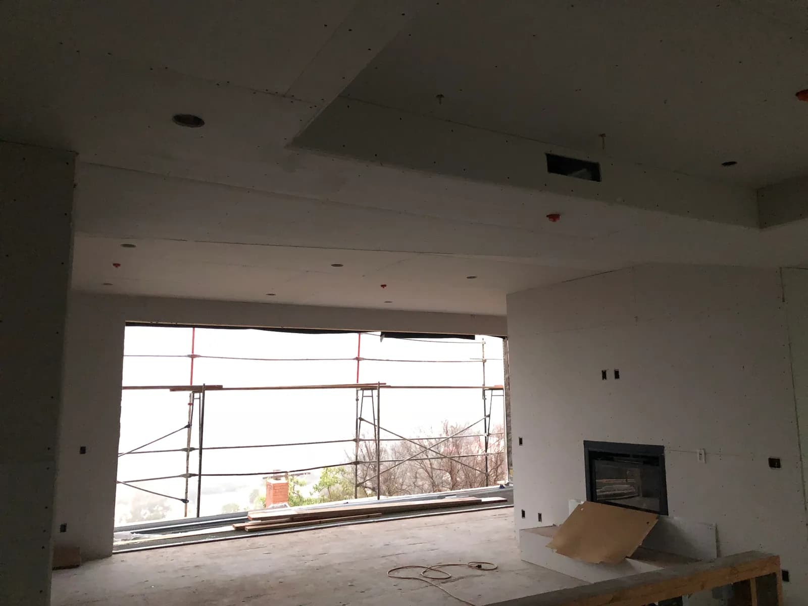 Interior with board hung and a large opening framed to the view.